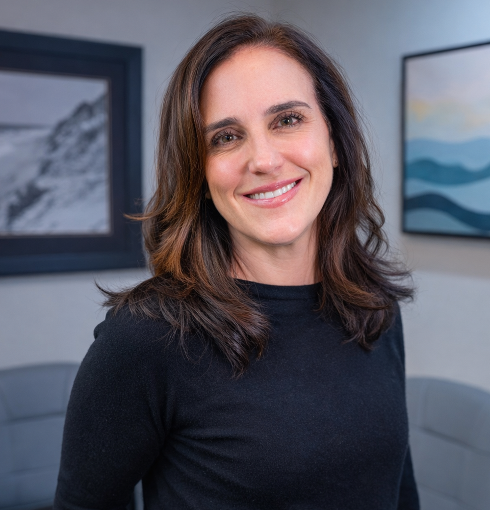 Dr. Melanie Rabeni standing in her Lobby smiling